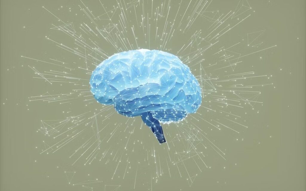 Digitally generated image of a blue glowing brain with particles moving from the center against a beige background.