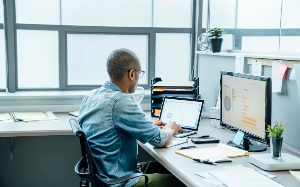 A person working with a computer in an office